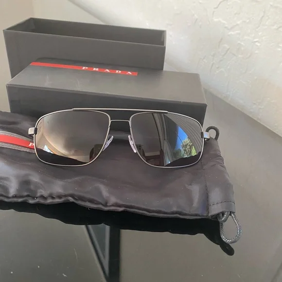 Prada sunglasses with the glasses bag and box